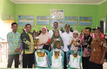 Ratusan Warga Kampung Sriwijaya Terima Bantuan Pangan